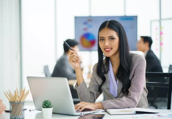 young-happy-asian-businesswoman-working-use-computer-laptop-thinking-idea-her-business-min-scaled